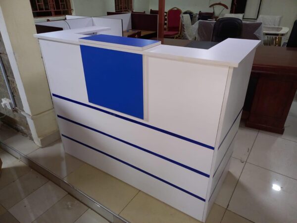 reception desk, modern reception desk, office reception desk, front office desk, reception counter, reception table, salon reception desk, hotel reception desk, business reception desk, contemporary reception desk, L-shaped reception desk, U-shaped reception desk, wooden reception desk, glass reception desk, custom reception desk, compact reception desk, stylish reception desk, small reception desk, large reception desk, curved reception desk, luxury reception desk, modular reception desk, affordable reception desk, reception desk with drawers, reception desk with shelves, reception desk with storage, minimalist reception desk, premium reception desk, reception area furniture, reception workstation, executive reception desk, reception desk Kenya, reception desk Nairobi, office reception counter, reception furniture set, front desk, receptionist table, office front desk furniture, modern lobby desk, reception desk design, elegant reception desk, reception desk with lighting, curved front desk, reception counter with signage, high-end reception desk, custom-built reception desk, front office furniture, salon front desk, front counter, sleek reception desk, minimalist front desk, front desk for office, welcome desk, boutique reception desk, compact lobby desk, office entrance desk, front office workstation, modular front counter, modern entry desk, executive lobby desk, office receiving counter, reception desk with branding panel, hotel front desk, dental reception desk, medical reception desk, front counter furniture, classic reception desk, durable reception desk, high gloss reception desk, matte finish reception desk, front desk with LED lights, acrylic reception desk, metal reception desk, ergonomic reception desk, compact welcome desk, professional reception desk, multi-level reception desk, front office reception unit, open front reception desk, front desk with privacy screen, two-tone reception desk, reception area counter, visitor greeting desk, clinic reception desk, bank reception desk, customized reception counter, reception bar counter, office welcome counter, modern business desk, curved reception counter, school reception desk, institution front desk, portable reception desk, reception desk with wheels, reception counter with cabinet, high reception counter, corporate reception desk, reception desk for entrance, showroom reception desk, retail front desk, aesthetic reception desk, reception kiosk, entry point reception counter, dual-level reception desk, office check-in counter, reception corner desk, front office check-in table, small office front desk, waiting area reception desk, reception counter with display shelf, reception furniture solutions, branded reception desk, luxury front office desk, home office reception desk, minimalist lobby desk, front office design table, interior reception furniture, front desk with drawers and shelves, welcome area desk, reception bench with desk, reception podium, reception desk package, office entry desk, multifunction reception table, laminated reception desk, melamine reception desk, woodgrain reception desk, black reception desk, white reception desk, brown reception desk, grey reception desk, executive front desk, professional front office table, business welcome desk, corporate welcome table, office furniture front desk, reception office set, waiting room counter, modern reception counter furniture, reception furniture Kenya, reception tables Nairobi, front desk installation, best reception desks Nairobi, affordable front office desk Kenya, top reception desk suppliers Kenya, modern office entrance desk, reception desk with file storage, salon counter design, stylish entrance desk, decorative reception table, entry desk with signage holder, reception desk with drawers and cabinet, client greeting table, reception setup furniture, office lobby interior furniture, customer care desk, front area counter, client service desk, welcome counter, reception workstation furniture, waiting area desk unit, reception desk for lobby, reception unit with lockable drawers, secure reception counter, reception desk with filing space, workstation reception combo, reception furniture arrangement, entry point desk for business, high-traffic reception desk, workstation style reception table, hospitality front desk, office desk for reception area, open reception counter, panel-based reception desk, low reception counter, double-sided reception desk, open plan reception desk, compact front desk for small offices, reception desk furniture solution, elegant front desk furniture, best reception desk design, multi-purpose reception table, reception console desk, reception area workstation, front desk workspace, ergonomic receptionist desk, retail store reception desk, multifunctional reception furniture, workstation and reception combo, durable front office desk, visitor handling desk, greeting area counter, reception console, office reception design ideas, and reception counter with nameplate.