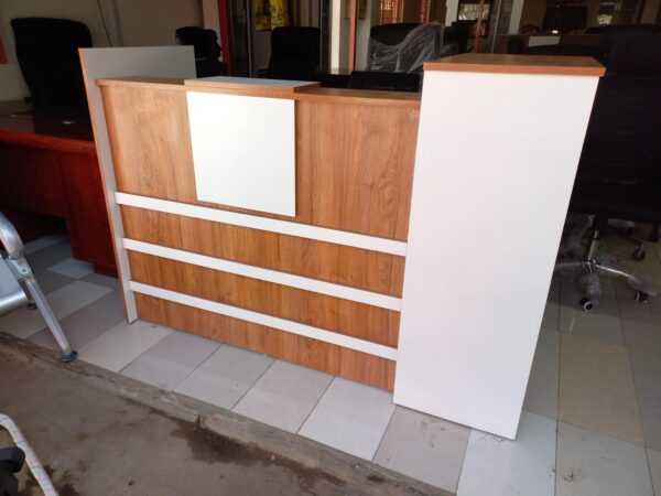 reception desk, modern reception desk, office reception desk, front office desk, reception counter, reception table, salon reception desk, hotel reception desk, business reception desk, contemporary reception desk, L-shaped reception desk, U-shaped reception desk, wooden reception desk, glass reception desk, custom reception desk, compact reception desk, stylish reception desk, small reception desk, large reception desk, curved reception desk, luxury reception desk, modular reception desk, affordable reception desk, reception desk with drawers, reception desk with shelves, reception desk with storage, minimalist reception desk, premium reception desk, reception area furniture, reception workstation, executive reception desk, reception desk Kenya, reception desk Nairobi, office reception counter, reception furniture set, front desk, receptionist table, office front desk furniture, modern lobby desk, reception desk design, elegant reception desk, reception desk with lighting, curved front desk, reception counter with signage, high-end reception desk, custom-built reception desk, front office furniture, salon front desk, front counter, sleek reception desk, minimalist front desk, front desk for office, welcome desk, boutique reception desk, compact lobby desk, office entrance desk, front office workstation, modular front counter, modern entry desk, executive lobby desk, office receiving counter, reception desk with branding panel, hotel front desk, dental reception desk, medical reception desk, front counter furniture, classic reception desk, durable reception desk, high gloss reception desk, matte finish reception desk, front desk with LED lights, acrylic reception desk, metal reception desk, ergonomic reception desk, compact welcome desk, professional reception desk, multi-level reception desk, front office reception unit, open front reception desk, front desk with privacy screen, two-tone reception desk, reception area counter, visitor greeting desk, clinic reception desk, bank reception desk, customized reception counter, reception bar counter, office welcome counter, modern business desk, curved reception counter, school reception desk, institution front desk, portable reception desk, reception desk with wheels, reception counter with cabinet, high reception counter, corporate reception desk, reception desk for entrance, showroom reception desk, retail front desk, aesthetic reception desk, reception kiosk, entry point reception counter, dual-level reception desk, office check-in counter, reception corner desk, front office check-in table, small office front desk, waiting area reception desk, reception counter with display shelf, reception furniture solutions, branded reception desk, luxury front office desk, home office reception desk, minimalist lobby desk, front office design table, interior reception furniture, front desk with drawers and shelves, welcome area desk, reception bench with desk, reception podium, reception desk package, office entry desk, multifunction reception table, laminated reception desk, melamine reception desk, woodgrain reception desk, black reception desk, white reception desk, brown reception desk, grey reception desk, executive front desk, professional front office table, business welcome desk, corporate welcome table, office furniture front desk, reception office set, waiting room counter, modern reception counter furniture, reception furniture Kenya, reception tables Nairobi, front desk installation, best reception desks Nairobi, affordable front office desk Kenya, top reception desk suppliers Kenya, modern office entrance desk, reception desk with file storage, salon counter design, stylish entrance desk, decorative reception table, entry desk with signage holder, reception desk with drawers and cabinet, client greeting table, reception setup furniture, office lobby interior furniture, customer care desk, front area counter, client service desk, welcome counter, reception workstation furniture, waiting area desk unit, reception desk for lobby, reception unit with lockable drawers, secure reception counter, reception desk with filing space, workstation reception combo, reception furniture arrangement, entry point desk for business, high-traffic reception desk, workstation style reception table, hospitality front desk, office desk for reception area, open reception counter, panel-based reception desk, low reception counter, double-sided reception desk, open plan reception desk, compact front desk for small offices, reception desk furniture solution, elegant front desk furniture, best reception desk design, multi-purpose reception table, reception console desk, reception area workstation, front desk workspace, ergonomic receptionist desk, retail store reception desk, multifunctional reception furniture, workstation and reception combo, durable front office desk, visitor handling desk, greeting area counter, reception console, office reception design ideas, and reception counter with nameplate.