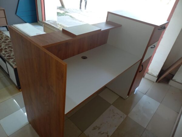 reception desk, modern reception desk, office reception desk, front office desk, reception counter, reception table, salon reception desk, hotel reception desk, business reception desk, contemporary reception desk, L-shaped reception desk, U-shaped reception desk, wooden reception desk, glass reception desk, custom reception desk, compact reception desk, stylish reception desk, small reception desk, large reception desk, curved reception desk, luxury reception desk, modular reception desk, affordable reception desk, reception desk with drawers, reception desk with shelves, reception desk with storage, minimalist reception desk, premium reception desk, reception area furniture, reception workstation, executive reception desk, reception desk Kenya, reception desk Nairobi, office reception counter, reception furniture set, front desk, receptionist table, office front desk furniture, modern lobby desk, reception desk design, elegant reception desk, reception desk with lighting, curved front desk, reception counter with signage, high-end reception desk, custom-built reception desk, front office furniture, salon front desk, front counter, sleek reception desk, minimalist front desk, front desk for office, welcome desk, boutique reception desk, compact lobby desk, office entrance desk, front office workstation, modular front counter, modern entry desk, executive lobby desk, office receiving counter, reception desk with branding panel, hotel front desk, dental reception desk, medical reception desk, front counter furniture, classic reception desk, durable reception desk, high gloss reception desk, matte finish reception desk, front desk with LED lights, acrylic reception desk, metal reception desk, ergonomic reception desk, compact welcome desk, professional reception desk, multi-level reception desk, front office reception unit, open front reception desk, front desk with privacy screen, two-tone reception desk, reception area counter, visitor greeting desk, clinic reception desk, bank reception desk, customized reception counter, reception bar counter, office welcome counter, modern business desk, curved reception counter, school reception desk, institution front desk, portable reception desk, reception desk with wheels, reception counter with cabinet, high reception counter, corporate reception desk, reception desk for entrance, showroom reception desk, retail front desk, aesthetic reception desk, reception kiosk, entry point reception counter, dual-level reception desk, office check-in counter, reception corner desk, front office check-in table, small office front desk, waiting area reception desk, reception counter with display shelf, reception furniture solutions, branded reception desk, luxury front office desk, home office reception desk, minimalist lobby desk, front office design table, interior reception furniture, front desk with drawers and shelves, welcome area desk, reception bench with desk, reception podium, reception desk package, office entry desk, multifunction reception table, laminated reception desk, melamine reception desk, woodgrain reception desk, black reception desk, white reception desk, brown reception desk, grey reception desk, executive front desk, professional front office table, business welcome desk, corporate welcome table, office furniture front desk, reception office set, waiting room counter, modern reception counter furniture, reception furniture Kenya, reception tables Nairobi, front desk installation, best reception desks Nairobi, affordable front office desk Kenya, top reception desk suppliers Kenya, modern office entrance desk, reception desk with file storage, salon counter design, stylish entrance desk, decorative reception table, entry desk with signage holder, reception desk with drawers and cabinet, client greeting table, reception setup furniture, office lobby interior furniture, customer care desk, front area counter, client service desk, welcome counter, reception workstation furniture, waiting area desk unit, reception desk for lobby, reception unit with lockable drawers, secure reception counter, reception desk with filing space, workstation reception combo, reception furniture arrangement, entry point desk for business, high-traffic reception desk, workstation style reception table, hospitality front desk, office desk for reception area, open reception counter, panel-based reception desk, low reception counter, double-sided reception desk, open plan reception desk, compact front desk for small offices, reception desk furniture solution, elegant front desk furniture, best reception desk design, multi-purpose reception table, reception console desk, reception area workstation, front desk workspace, ergonomic receptionist desk, retail store reception desk, multifunctional reception furniture, workstation and reception combo, durable front office desk, visitor handling desk, greeting area counter, reception console, office reception design ideas, and reception counter with nameplate.