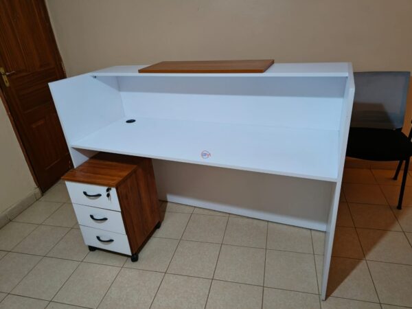 reception desk, modern reception desk, office reception desk, front office desk, reception counter, reception table, salon reception desk, hotel reception desk, business reception desk, contemporary reception desk, L-shaped reception desk, U-shaped reception desk, wooden reception desk, glass reception desk, custom reception desk, compact reception desk, stylish reception desk, small reception desk, large reception desk, curved reception desk, luxury reception desk, modular reception desk, affordable reception desk, reception desk with drawers, reception desk with shelves, reception desk with storage, minimalist reception desk, premium reception desk, reception area furniture, reception workstation, executive reception desk, reception desk Kenya, reception desk Nairobi, office reception counter, reception furniture set, front desk, receptionist table, office front desk furniture, modern lobby desk, reception desk design, elegant reception desk, reception desk with lighting, curved front desk, reception counter with signage, high-end reception desk, custom-built reception desk, front office furniture, salon front desk, front counter, sleek reception desk, minimalist front desk, front desk for office, welcome desk, boutique reception desk, compact lobby desk, office entrance desk, front office workstation, modular front counter, modern entry desk, executive lobby desk, office receiving counter, reception desk with branding panel, hotel front desk, dental reception desk, medical reception desk, front counter furniture, classic reception desk, durable reception desk, high gloss reception desk, matte finish reception desk, front desk with LED lights, acrylic reception desk, metal reception desk, ergonomic reception desk, compact welcome desk, professional reception desk, multi-level reception desk, front office reception unit, open front reception desk, front desk with privacy screen, two-tone reception desk, reception area counter, visitor greeting desk, clinic reception desk, bank reception desk, customized reception counter, reception bar counter, office welcome counter, modern business desk, curved reception counter, school reception desk, institution front desk, portable reception desk, reception desk with wheels, reception counter with cabinet, high reception counter, corporate reception desk, reception desk for entrance, showroom reception desk, retail front desk, aesthetic reception desk, reception kiosk, entry point reception counter, dual-level reception desk, office check-in counter, reception corner desk, front office check-in table, small office front desk, waiting area reception desk, reception counter with display shelf, reception furniture solutions, branded reception desk, luxury front office desk, home office reception desk, minimalist lobby desk, front office design table, interior reception furniture, front desk with drawers and shelves, welcome area desk, reception bench with desk, reception podium, reception desk package, office entry desk, multifunction reception table, laminated reception desk, melamine reception desk, woodgrain reception desk, black reception desk, white reception desk, brown reception desk, grey reception desk, executive front desk, professional front office table, business welcome desk, corporate welcome table, office furniture front desk, reception office set, waiting room counter, modern reception counter furniture, reception furniture Kenya, reception tables Nairobi, front desk installation, best reception desks Nairobi, affordable front office desk Kenya, top reception desk suppliers Kenya, modern office entrance desk, reception desk with file storage, salon counter design, stylish entrance desk, decorative reception table, entry desk with signage holder, reception desk with drawers and cabinet, client greeting table, reception setup furniture, office lobby interior furniture, customer care desk, front area counter, client service desk, welcome counter, reception workstation furniture, waiting area desk unit, reception desk for lobby, reception unit with lockable drawers, secure reception counter, reception desk with filing space, workstation reception combo, reception furniture arrangement, entry point desk for business, high-traffic reception desk, workstation style reception table, hospitality front desk, office desk for reception area, open reception counter, panel-based reception desk, low reception counter, double-sided reception desk, open plan reception desk, compact front desk for small offices, reception desk furniture solution, elegant front desk furniture, best reception desk design, multi-purpose reception table, reception console desk, reception area workstation, front desk workspace, ergonomic receptionist desk, retail store reception desk, multifunctional reception furniture, workstation and reception combo, durable front office desk, visitor handling desk, greeting area counter, reception console, office reception design ideas, and reception counter with nameplate.