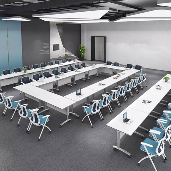 Flexible Meeting Solutions with the Folding Conference Room Table Maximize your workspace with the Folding Conference Room Table, a versatile and practical solution for modern offices, training rooms, and event spaces. Designed for flexibility, this table combines professional aesthetics with the convenience of easy folding and storage. Making it perfect for both permanent and temporary setups. Space-Saving and Portable Design The foldable structure allows you to quickly set up or store the conference table as needed, freeing up valuable floor space when not in use. Equipped with smooth-rolling lockable casters, it’s easy to move between rooms, arrange in different layouts, or store away after meetings and events. Durable Build for Long-Term Use Constructed from high-quality materials, including a sturdy steel frame and a scratch-resistant laminated surface, the folding conference room table is built to handle frequent use. Its robust design ensures stability during meetings, training sessions, or presentations. While the easy-clean finish keeps it looking professional. Versatile for Multiple Applications This table adapts to a variety of environments—use it in boardrooms, collaborative workspaces, classrooms, or event halls. The sleek, modern design blends seamlessly with different office styles, ensuring your workspace remains polished and professional. Key Features of the Folding Conference Room Table Foldable design for quick setup and compact storage Lockable caster wheels for easy mobility and stability Scratch-resistant laminated tabletop for durability Sturdy steel frame for long-lasting performance Modern design suitable for corporate and educational settings Easy to clean and maintain for everyday use Perfect for Dynamic and Modern Workspaces Whether you need a table for regular meetings, training sessions, or occasional events, the Folding Conference Room Table delivers the flexibility, durability, and professional look your business needs. Its space-saving design ensures you can adapt your room layout effortlessly, making it an essential asset for any dynamic workspace.