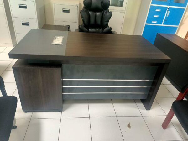 Executive office desk at Furniture Village Kenya. executive office desk, modern executive desk, luxury executive office desk, wooden executive desk, executive computer desk, ergonomic executive desk, large executive office table, executive office workstation, L-shaped executive desk, executive manager desk, executive CEO desk, office executive furniture, modern office executive desk, executive desk with drawers, executive desk with cabinet, high end executive desk, contemporary executive office desk, stylish executive desk design, professional executive office furniture, executive writing desk, executive office workstation table, executive office furniture set, executive office desk with storage, modern wooden executive desk, elegant executive office furniture, executive director desk, executive office setup, luxury office desk, imported executive office desk, office manager desk, premium executive office furniture, executive desk with return, modular executive workstation desk, large workspace executive desk, executive office furniture kenya, ergonomic office executive workstation, executive office desk for productivity, spacious executive office table, executive office desk with side return, office boss desk, executive home office desk, executive office workstation furniture, professional workspace executive table, executive office desk with filing cabinet, modern executive workstation table, office director executive desk, office CEO workstation desk, stylish office executive desk, modern office furniture desk, wooden office executive table, executive desk with storage drawers, professional executive desk design, executive office setup ideas, executive office workstation kenya, modern executive desk with shelves, office executive furniture collection, luxury executive desk design, sleek executive workstation table, elegant office executive desk, executive desk for managers, ergonomic office furniture desk, durable executive office table, executive desk with keyboard tray, modern office executive workstation setup, L-shaped executive office workstation, executive office furniture for home, premium quality executive desk, office workstation for directors, contemporary executive office workstation, executive office setup furniture, high quality executive desk design, stylish executive office workstation, elegant manager desk, modern executive desk furniture, office director table, executive office furniture design kenya, office workstation for executives, modern office desk setup, executive desk and chair set, executive office furniture for corporate offices, executive desk with lockable drawers, modern office workstation desk, professional office desk for executives, luxury office workstation furniture, modular executive workstation kenya, contemporary office desk design, executive workstation with file cabinet, ergonomic executive furniture setup, modern workspace executive desk, premium executive workstation furniture, executive desk with side storage, modern CEO office desk, elegant office workstation, executive office desk design ideas, contemporary manager office table, office executive workstation layout, luxury office desk kenya, stylish manager office workstation, professional director office desk, large executive office workstation, sleek executive desk design, executive workstation for productivity, high end office desk kenya, modern office executive furniture set