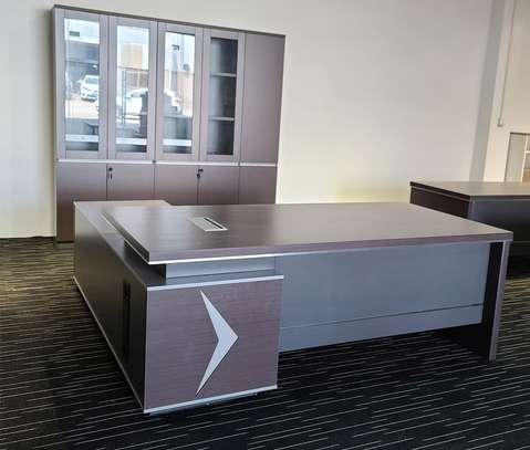executive office desks price at Furniture Village Kenya. office desk, office desks, office table, office tables, office work desk, office work table, office computer desk, office computer table, office workstation desk, office writing desk, office study desk, office furniture desk, modern office desk, contemporary office desk, professional office desk, corporate office desk, commercial office desk, business office desk, office desk for office, office desk for home office, office desk for study, office desk for work, office desk for corporate office, office desk for companies, office desk for startups, office desk for professionals, office desk for managers, office desk for executives, office desk for staff, office desk for employees, wooden office desk, MDF office desk, laminated office desk, metal office desk, steel office desk, glass top office desk, office desk with drawers, office desk with storage, office desk with cabinet, office desk with shelves, office desk with pedestal, office desk with filing cabinet, office desk with keyboard tray, office desk with CPU stand, office desk with cable management, L shaped office desk, straight office desk, U shaped office desk, corner office desk, compact office desk, small office desk, large office desk, minimalist office desk, ergonomic office desk, height adjustable office desk, electric office desk, sit stand office desk, fixed height office desk, office desk 120cm, office desk 140cm, office desk 160cm, office desk 180cm, office desk 200cm, office desk 240cm, office desk black, office desk white, office desk brown, office desk grey, office desk wood finish, office desk walnut finish, office desk oak finish, office desk mahogany finish, office desk for laptop, office desk for desktop, office desk for computer setup, office desk for productivity, office desk workspace furniture, office desk office furniture, office desk commercial furniture, office desk corporate furniture, office desk heavy duty, office desk durable, office desk scratch resistant, office desk easy maintenance, office desk modern design, office desk stylish, office desk affordable, office desk price, office desk cost, office desk for sale, buy office desk online, best office desk, office desk supplier, office desk manufacturer, office desk distributor, office desk wholesaler, office desk furniture shop, office desk showroom, office desk Kenya, office desk Nairobi, office desk office furniture Kenya, office desk delivery Kenya, office desk installation, office desk bulk supply, office desk wholesale Kenya.